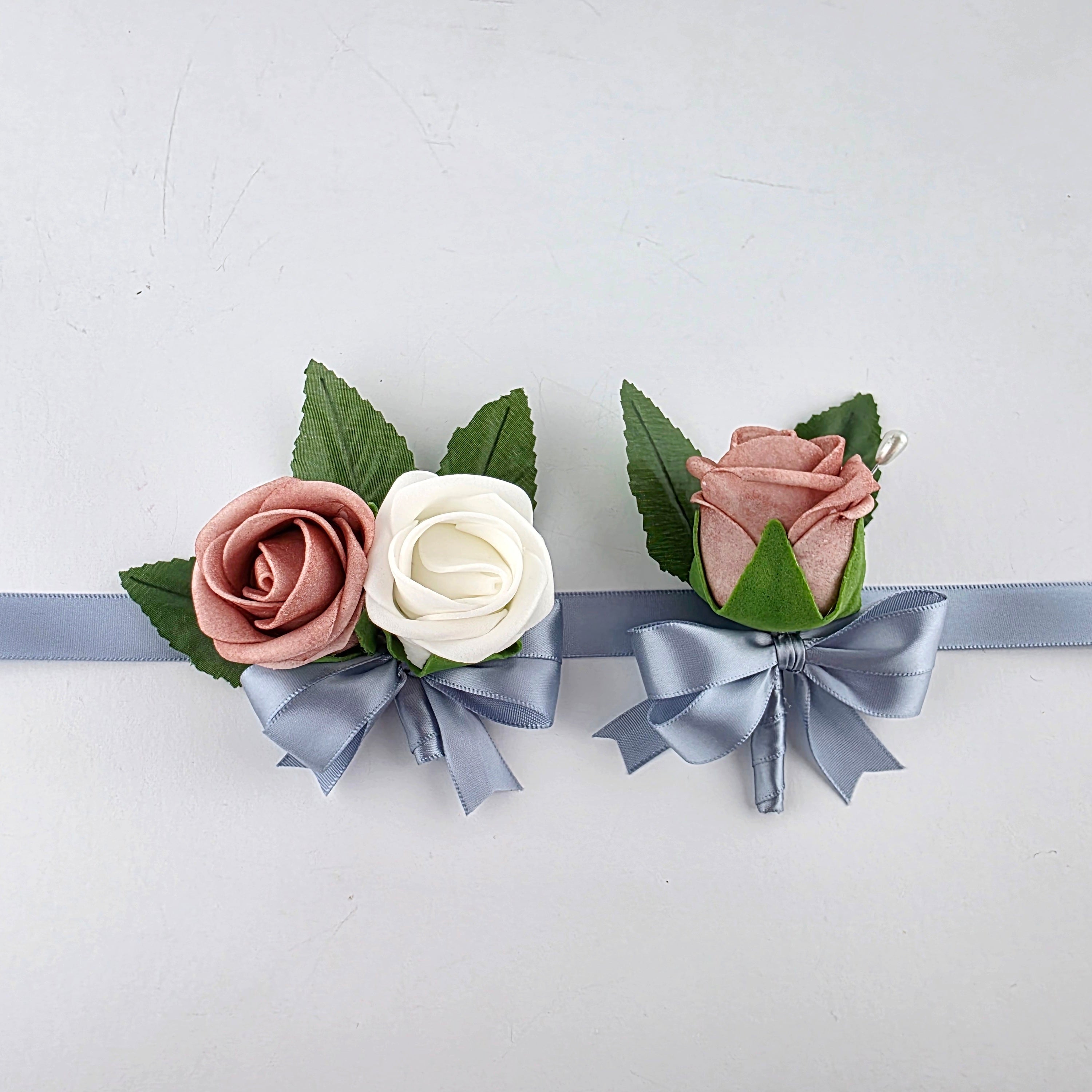 Dusty rose and white wrist corsage and boutonniere