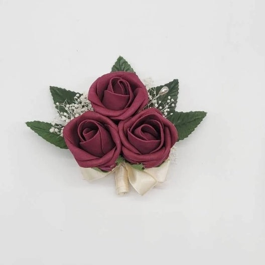 burgundy and ivory pin on corsage