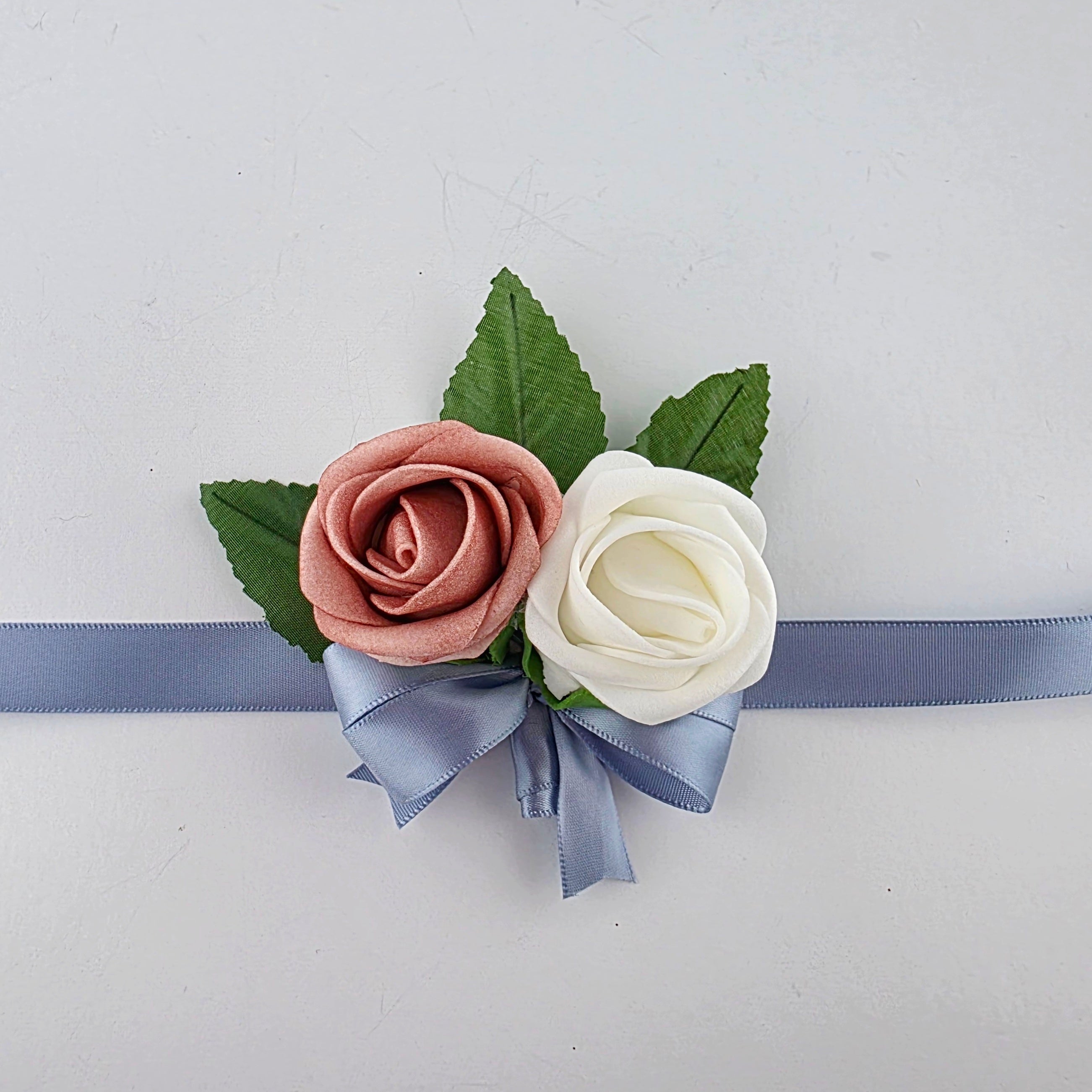 dusty rose and white wrist corsage children's