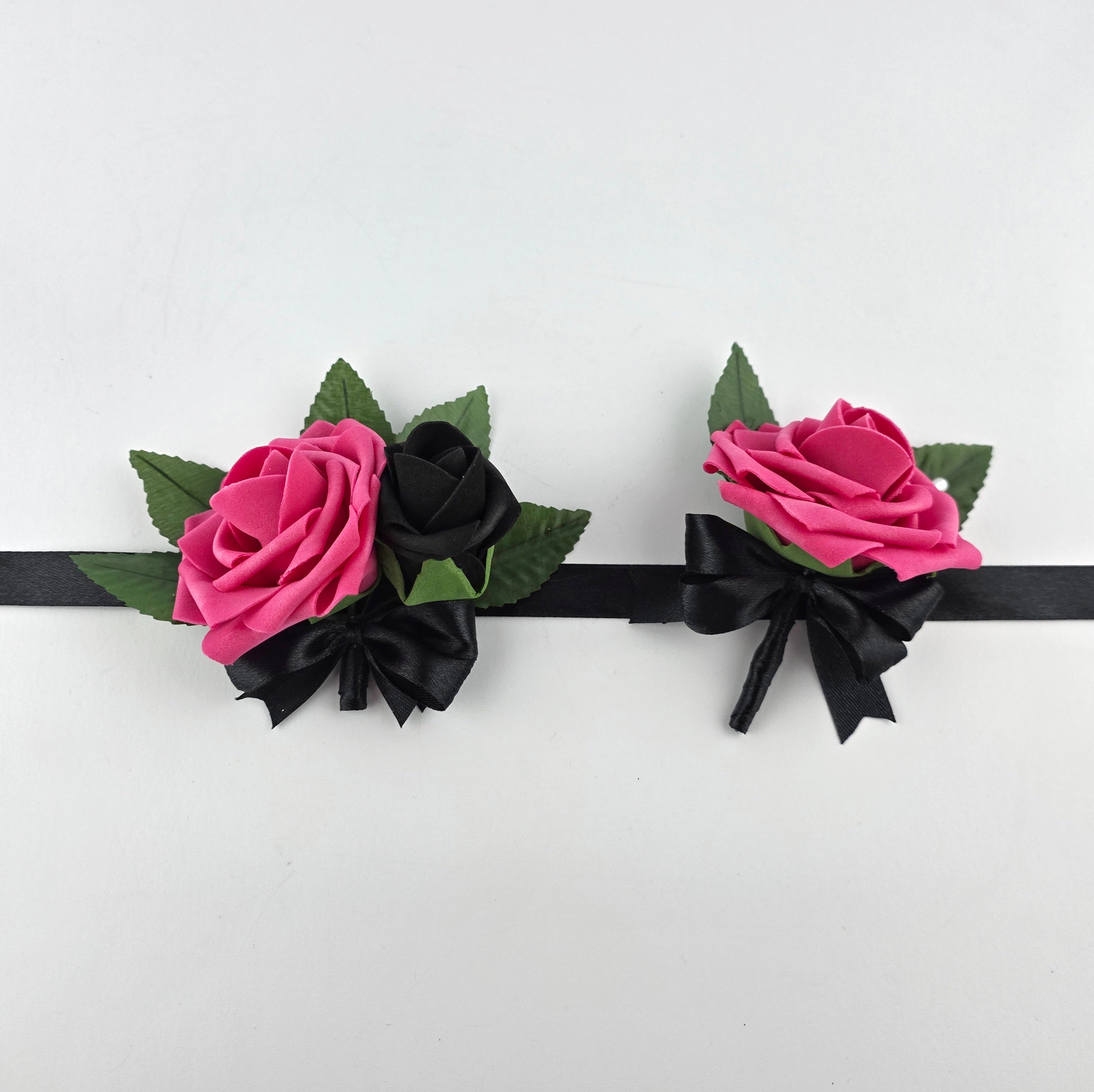 Hot pink and black wrist corsage and boutonniere
