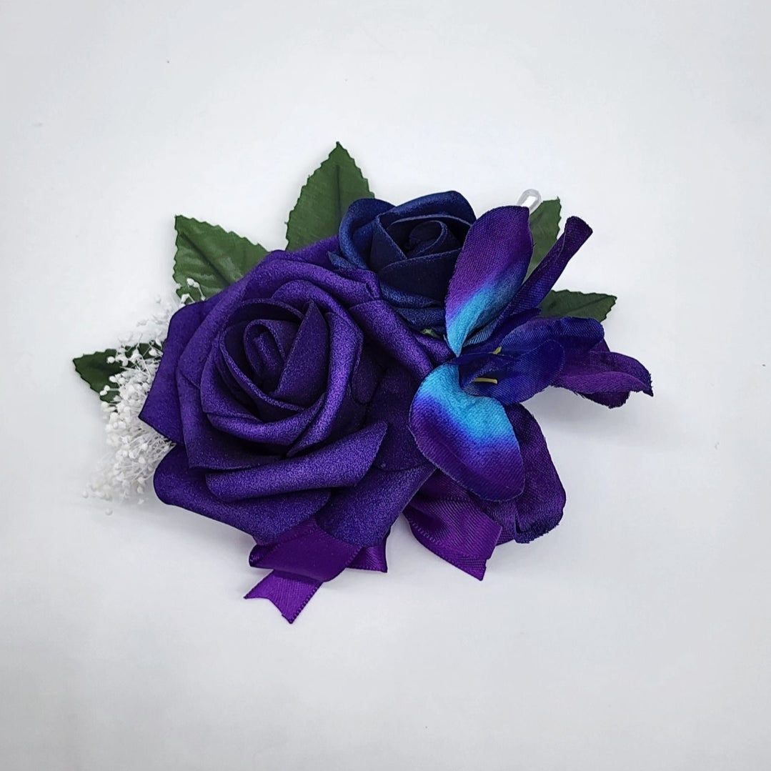 purple and royal blue corsage pin on