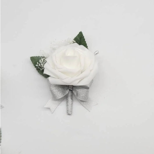 white and silver boutonniere with baby's breath
